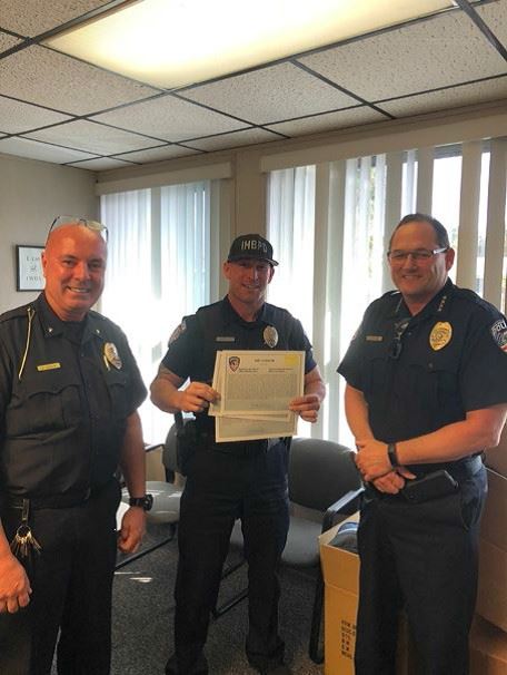 Officer Will Newman receiving a Lifesaving Award