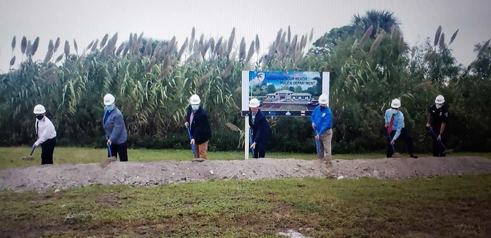 City Council members, City Manager Mark Ryan, and Chief of Police David Butler break ground